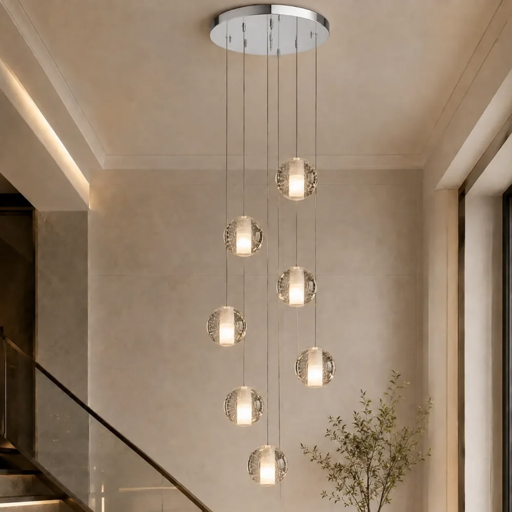 7-light cascading spiral crystal bubble chandelier suspended in a contemporary staircase foyer