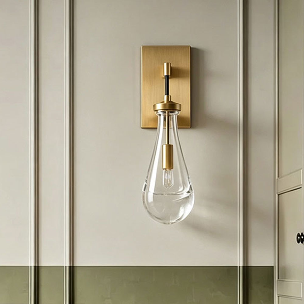 Single modern brass gold teardrop clear glass wall sconce, farmhouse bedside wall light, decorative wall lamp on panel wainscoting bedroom accent wall