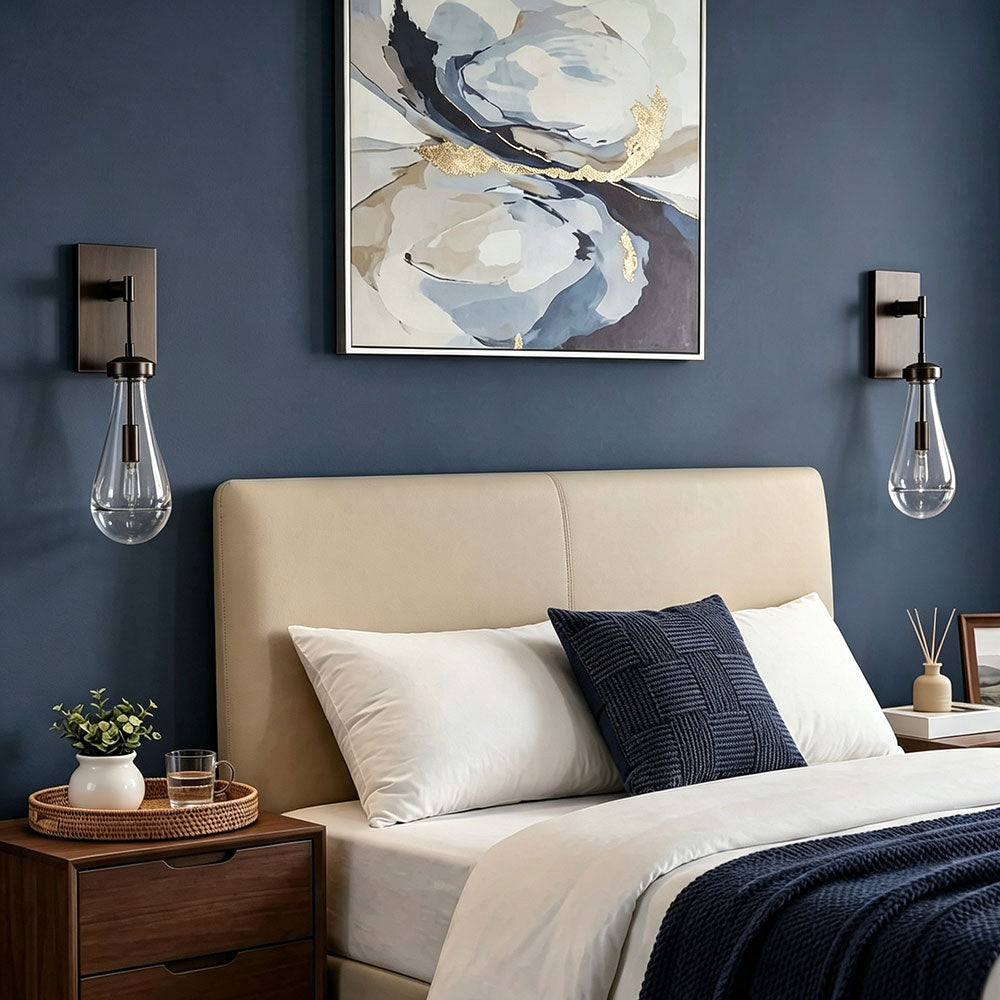 Modern gold brass teardrop clear glass wall sconce set, bedside wall lamp for bedroom interior decor, contemporary drop glass wall light mounted on dark blue bedroom wall