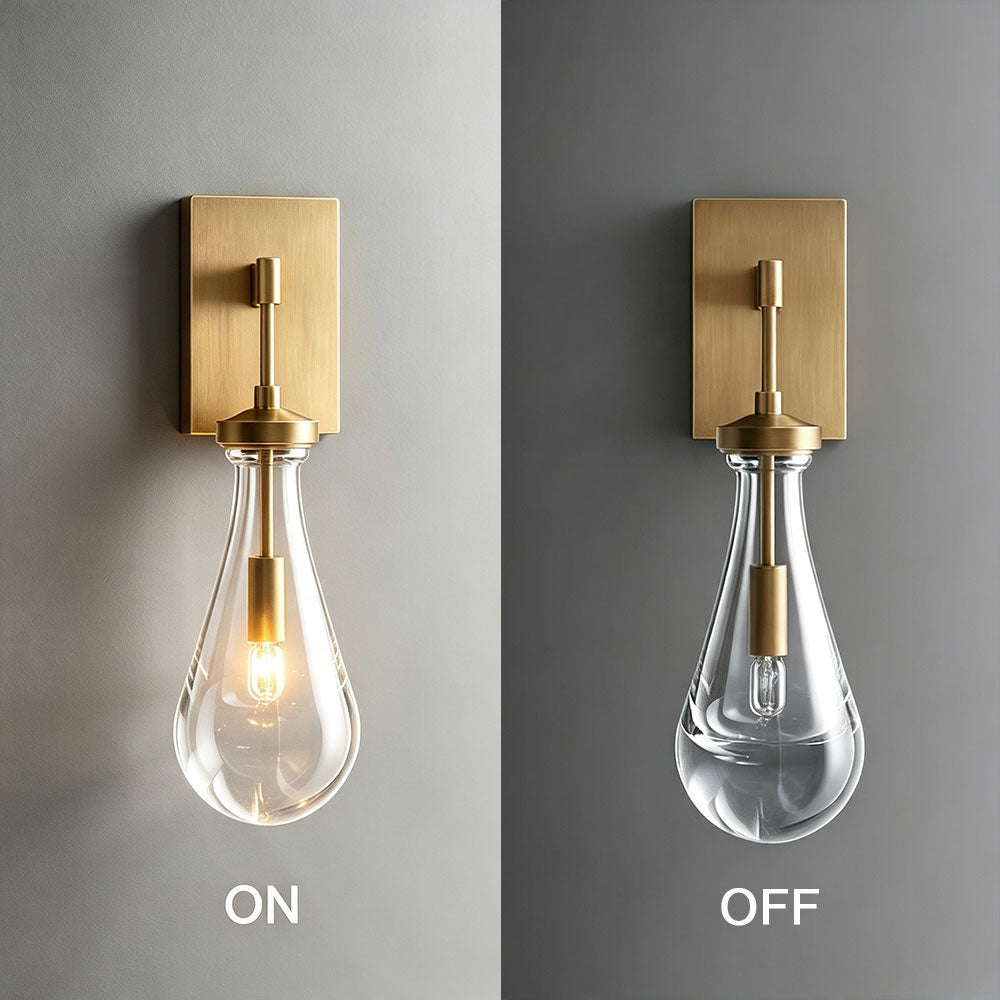 Brass gold teardrop clear glass wall sconce on and off comparison shot, modern single wall lamp showing lit and unlit bulb status, brushed brass metal base with teardrop glass shade