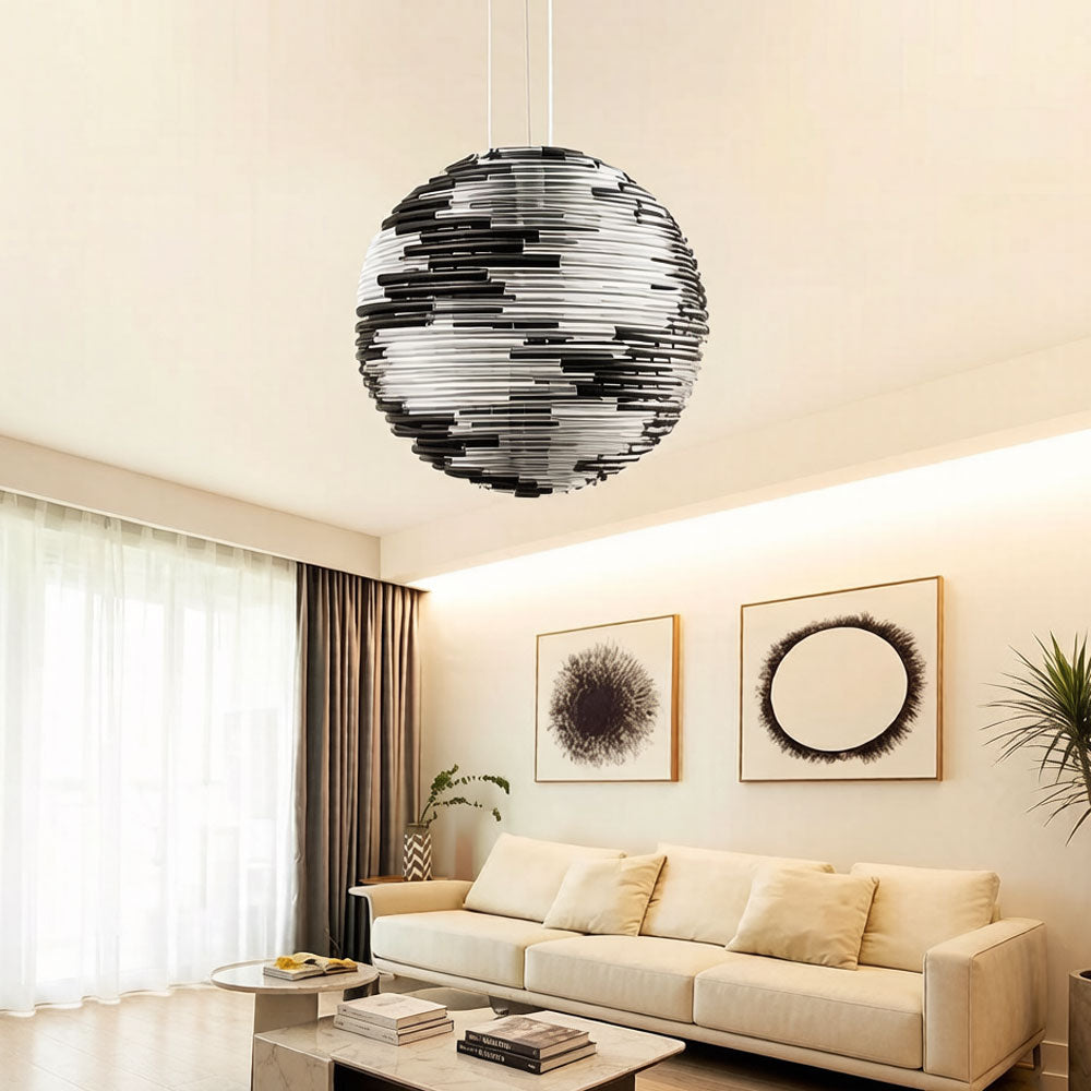 Nordic style glass globe pendant light in a bedroom with Scandinavian decor
