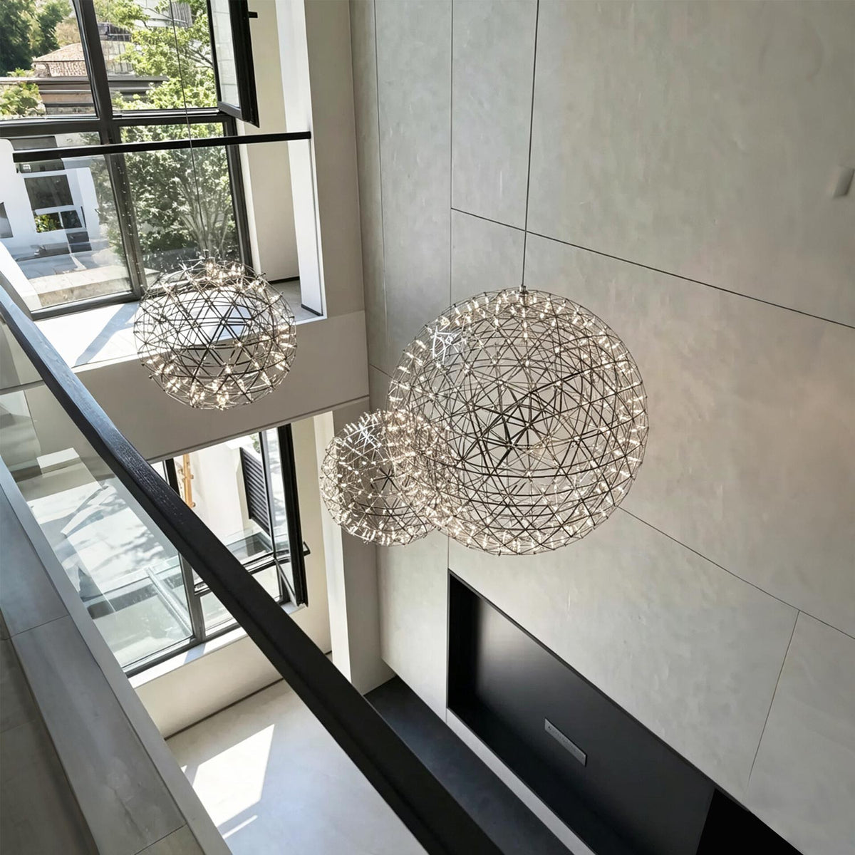 Modern globe pendant light with a black metal frame