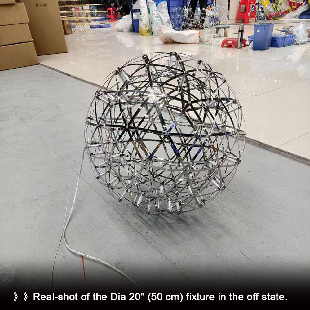 Globe pendant light with sacred geometry design illuminating a dining room