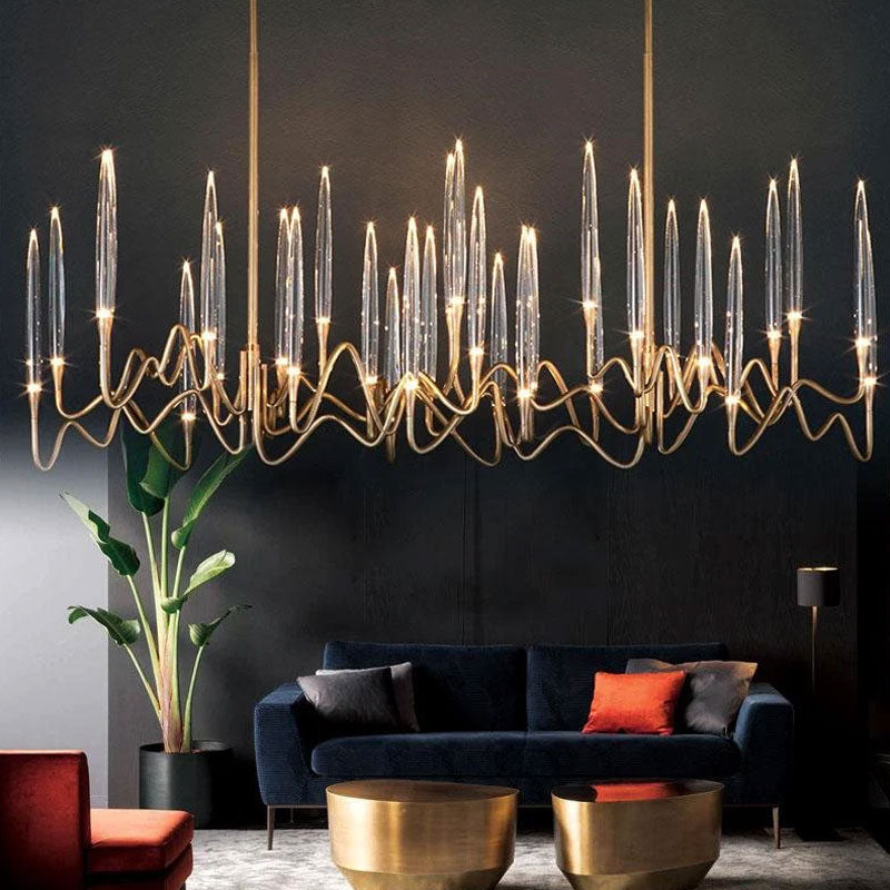 Candelabra kitchen island chandelier with matte gold frame in a contemporary dining space