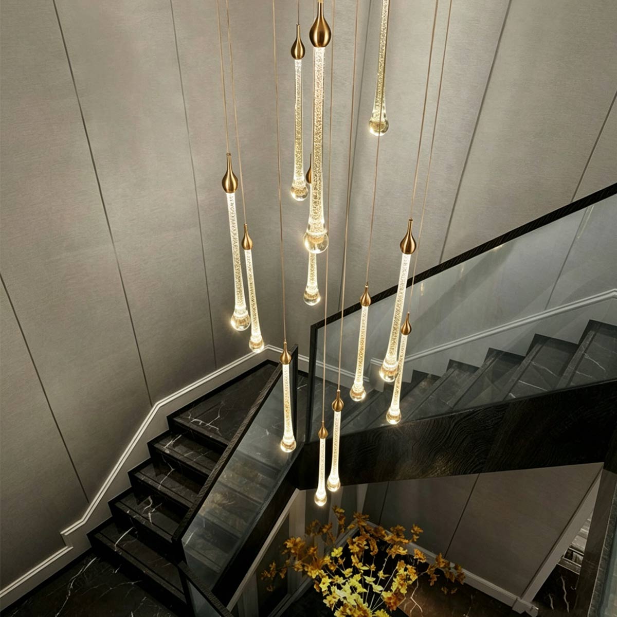 Staircase landing perspective showing sparkling golden glitter crystal pendants against modern dark stairs