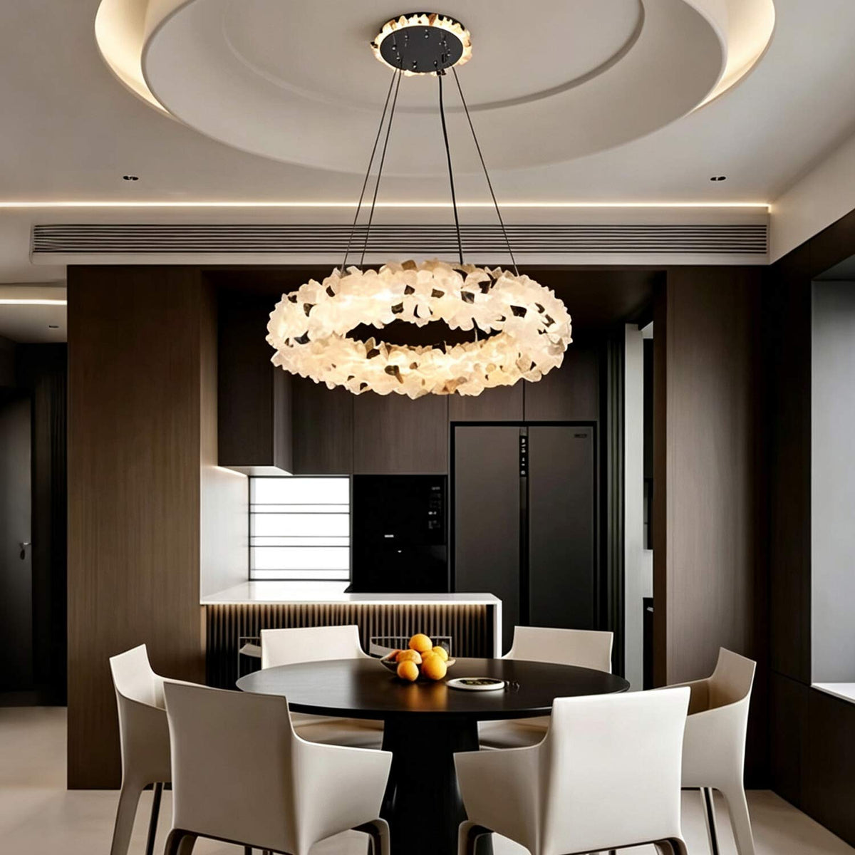 Luxury crystal ring chandelier glowing in a dark modern interior