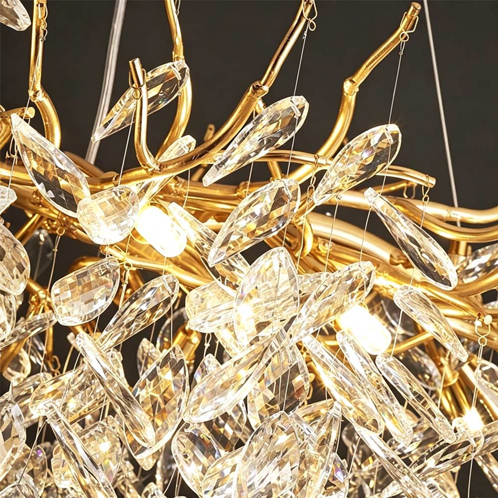 Close-up detail of Luxury Gold Branch Crystal Chandelier, gold metal branch frame with hand-cut clear crystal leaf pendants, luxury lighting fixture detail shot