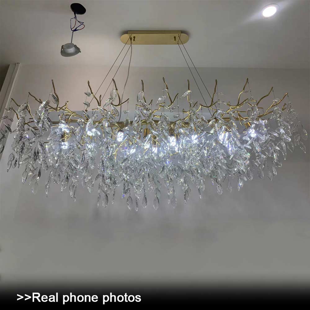 Real photo of Luxury Gold Branch Crystal Chandelier installation in progress, gold branch crystal pendant light being assembled on ceiling, real customer installation photo