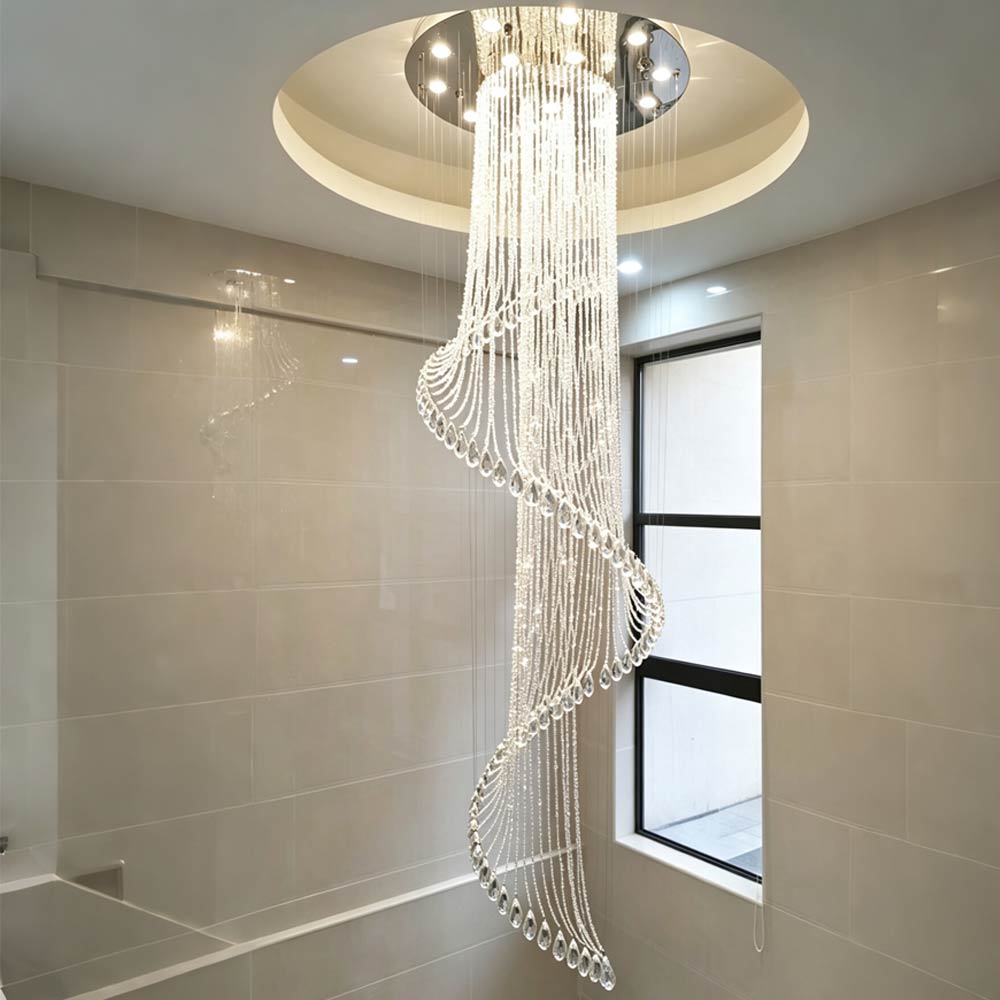 Luxury spiral crystal chandelier installed in a modern high-ceiling staircase