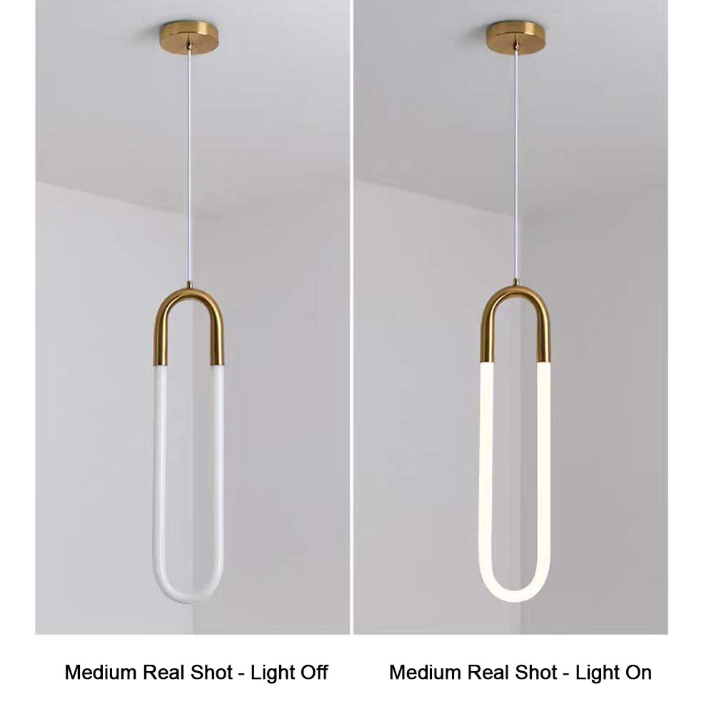 Minimalist U-shaped gold pendant light medium size real shot, light off and light on comparison, brass metal top with white jade glass diffuser, warm 3000K LED glow effect display