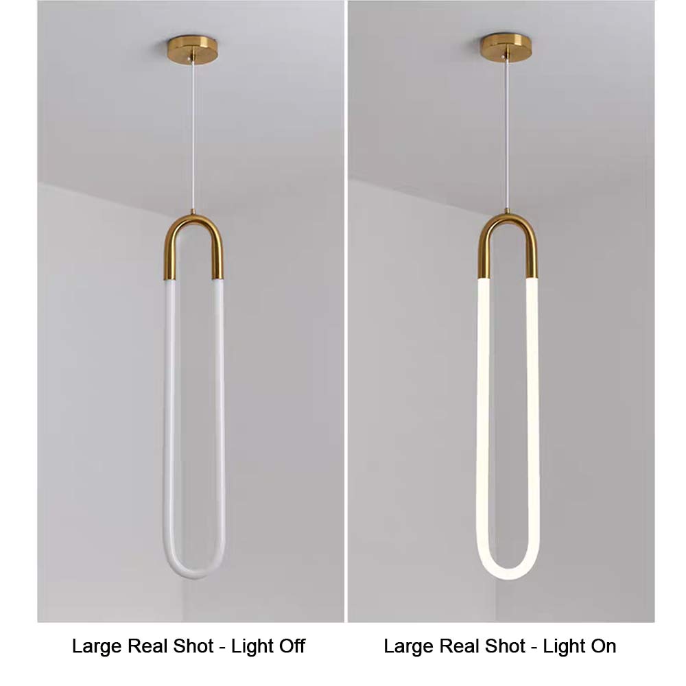 Minimalist U-shaped gold pendant light large size real shot, light off and light on comparison, brass metal top with white jade glass diffuser, warm 3000K LED glow effect display
