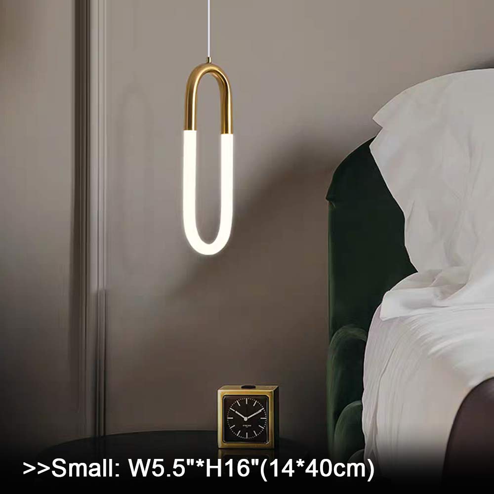 Single minimalist U-shaped gold pendant light in hallway or entryway, brass finish LED hanging lamp mounted in narrow corridor, modern minimalist indoor pendant light fixture scene