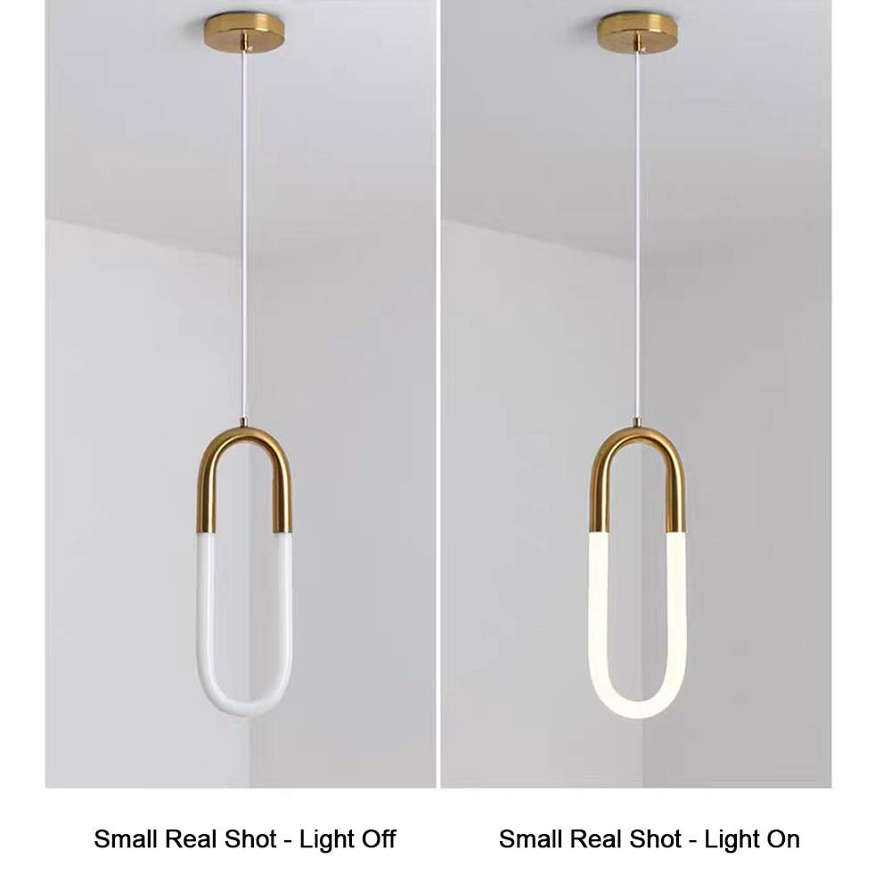 Minimalist U-shaped gold pendant light small size real shot, light off and light on comparison, brass metal top with white jade glass diffuser, warm 3000K LED glow effect display