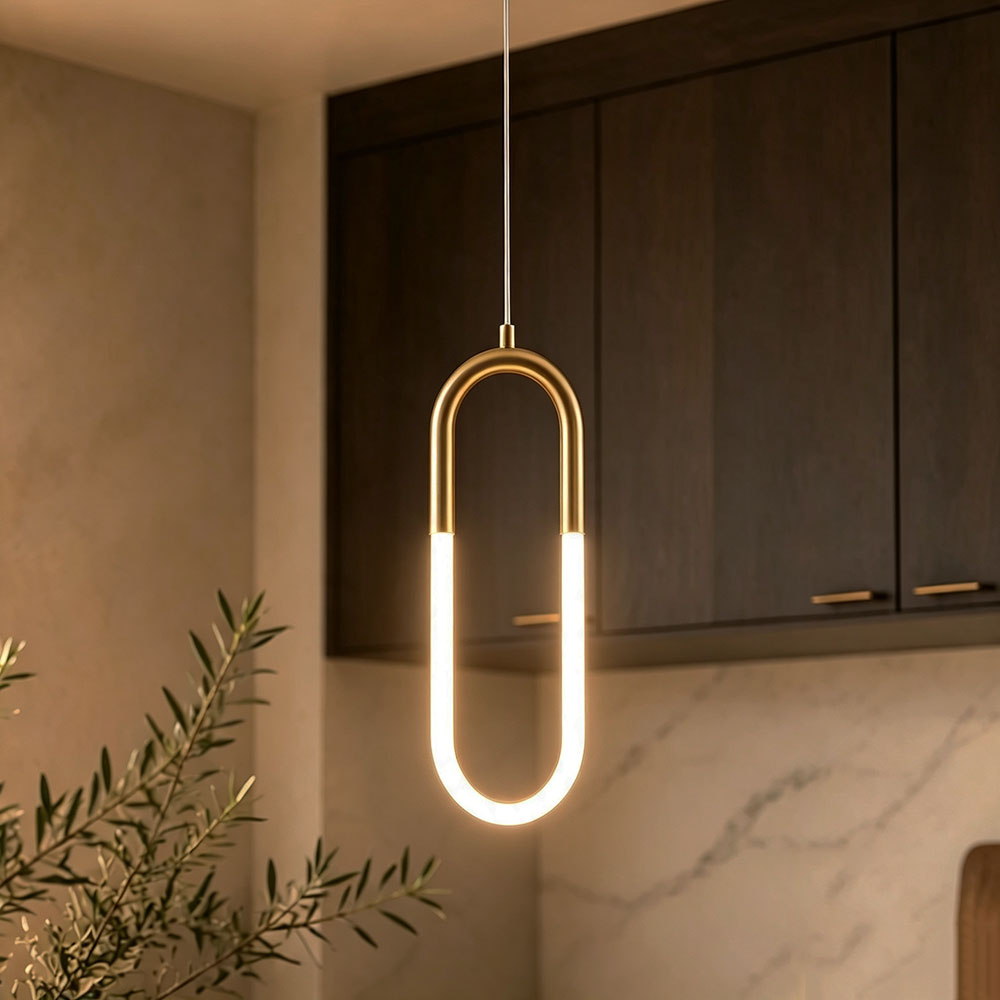 Gold U‑Shaped pendant light single unit, warm glow LED hanging lamp above kitchen counter, modern minimalist brass pendant lighting interior render