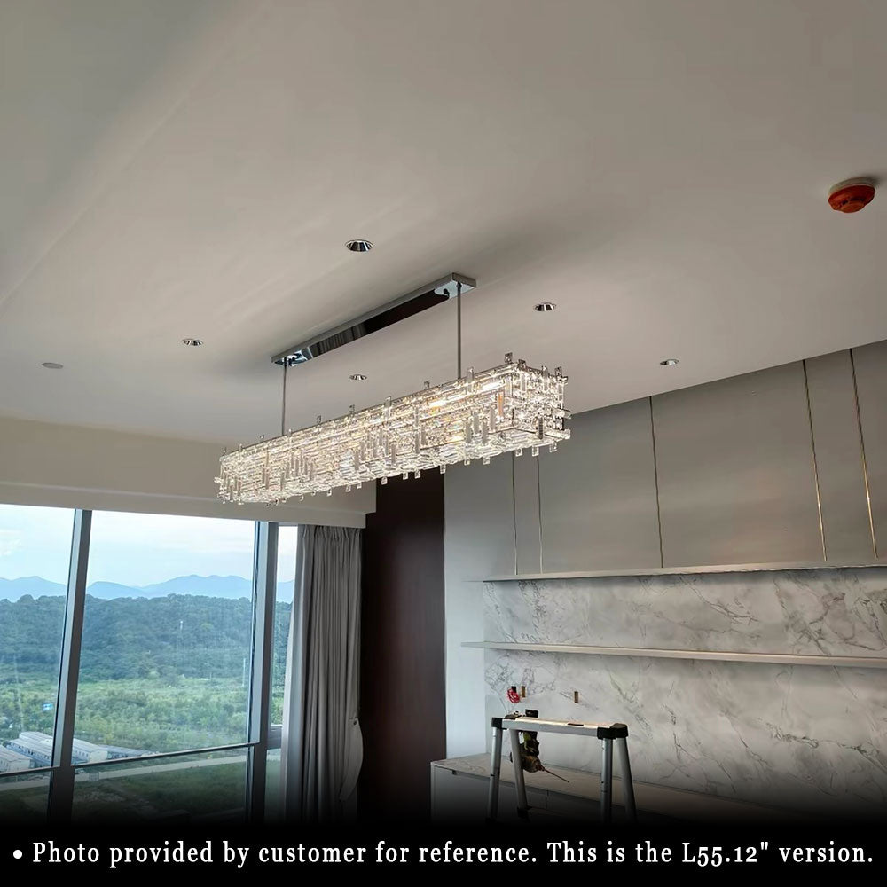 Modern Chrome Rectangular Crystal Chandelier, 55.12 inch crystal pendant light, customer real installation photo, warm lit fixture in high-rise modern residential kitchen area.