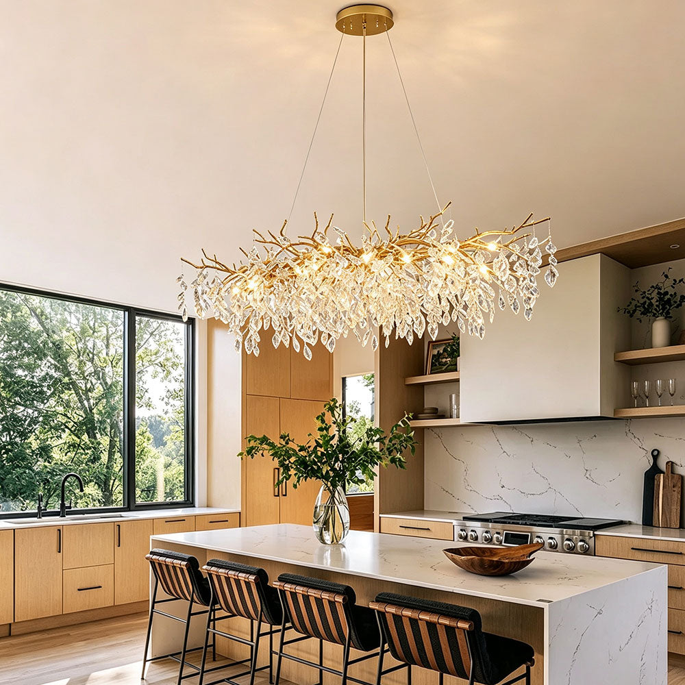 Luxury Gold Branch Crystal Chandelier above kitchen island in bright modern open-concept kitchen, warm white light, gold branch crystal hanging lamp for home decor