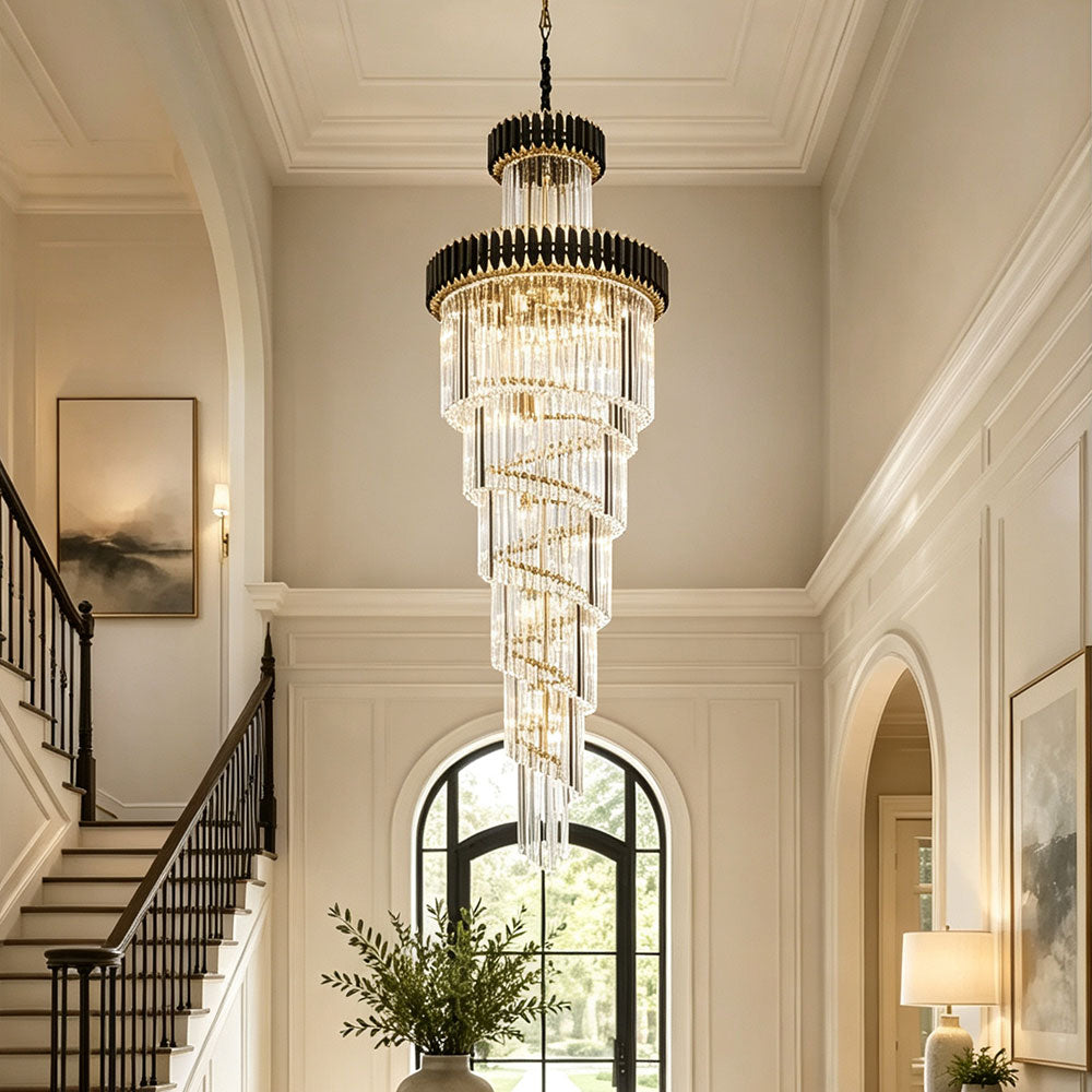 Modern Luxury spiral crystal chandelier, black gold tiered pendant light hanging in two-story staircase foyer high ceiling villa interior.