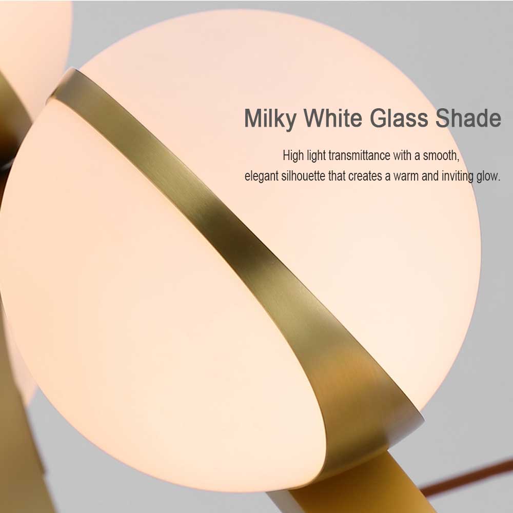 Modern Gold Ring Globe Glass Chandelier, lifestyle scene in contemporary interior, warm glowing milky glass sphere pendant light, mid-century circular ring ceiling fixture