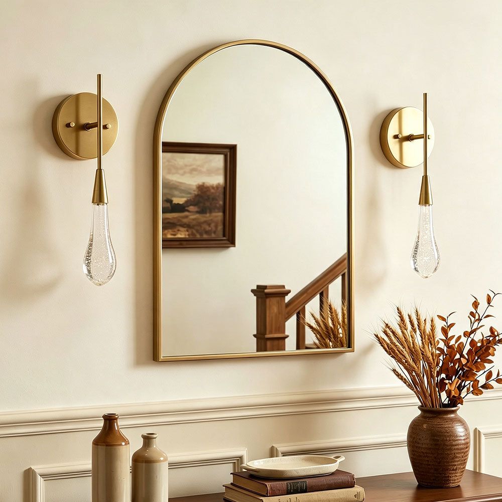 Modern brass teardrop bubble glass wall sconce pair, decorative vanity wall lamps flanking arched mirror, entryway bathroom wall light fixture with bubble glass shade