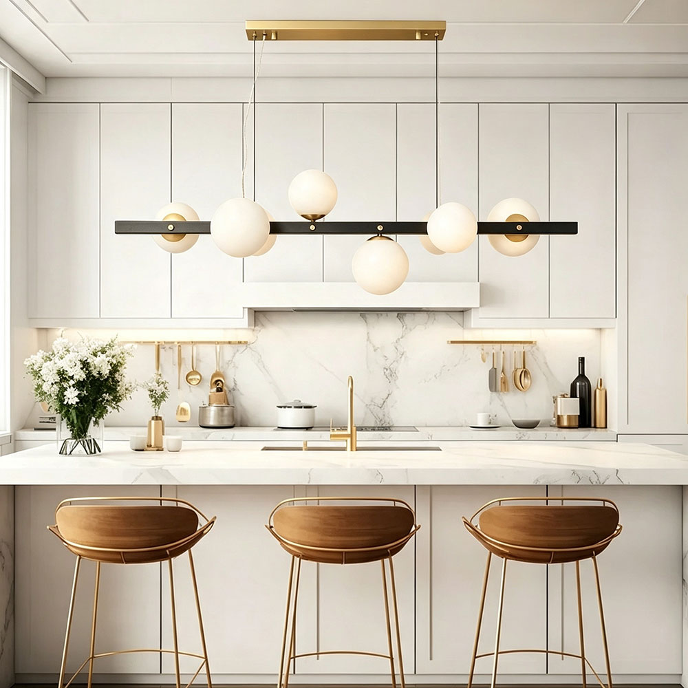 Black gold linear globe chandelier over modern white kitchen island, opal frosted glass globes, two‑tone metal pendant light for minimalist contemporary kitchen