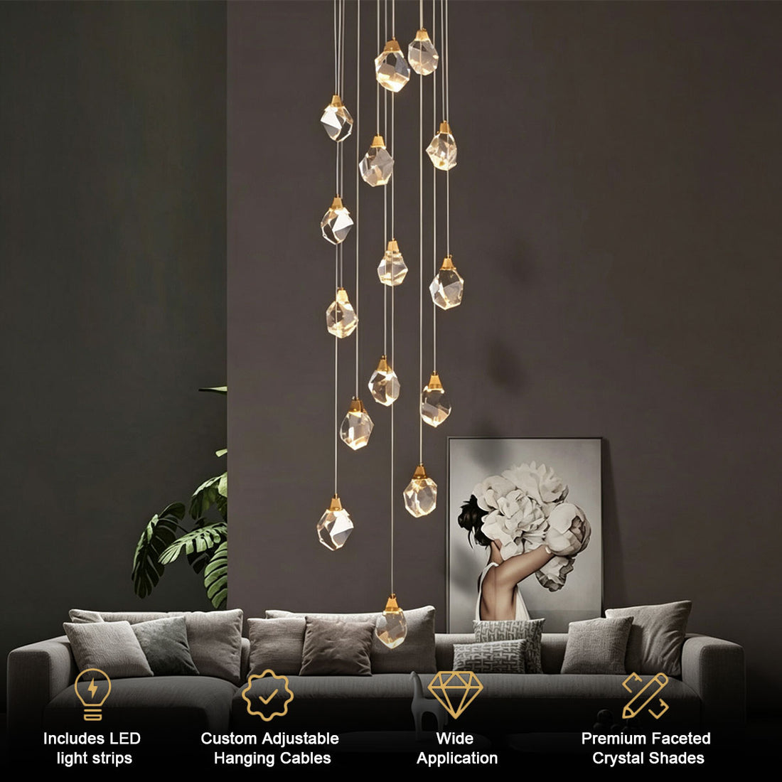 Diamond-shaped staircase chandelier with gold hardware in a grand double-height foyer