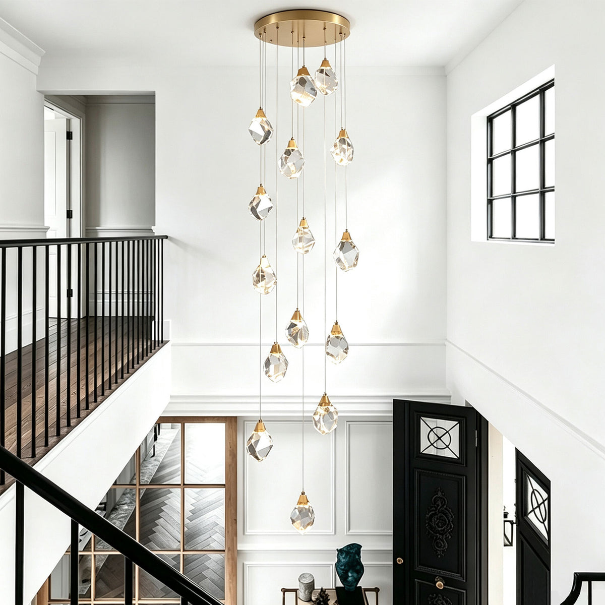 Modern pendant light installed above a bright staircase